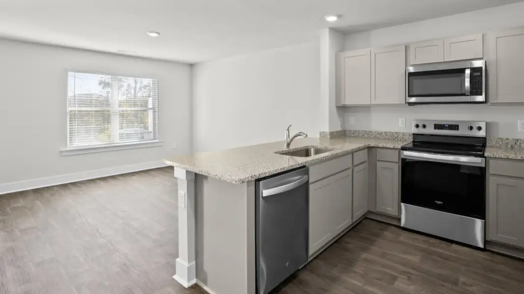 Furnished interior view inside a new home in The Townes at Cedar Hill Landing, Navassa (Image 6).
