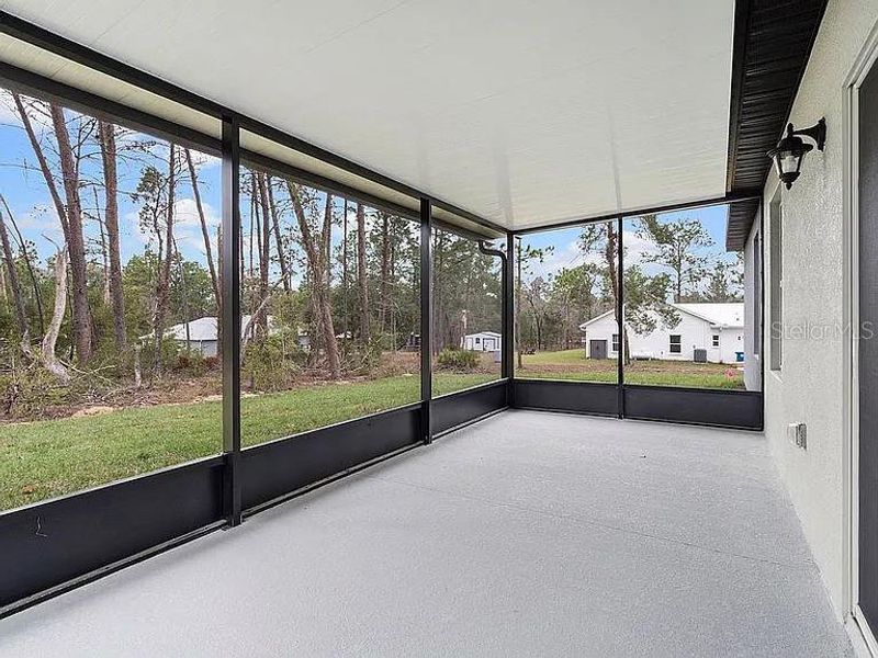Exterior details and patio area of a home in Royal Highlands, Brooksville (Image 4).