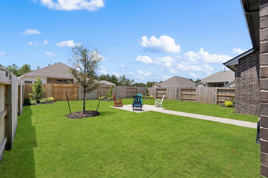 Exterior details and patio area of a home in Artavia, Conroe (Image 24).