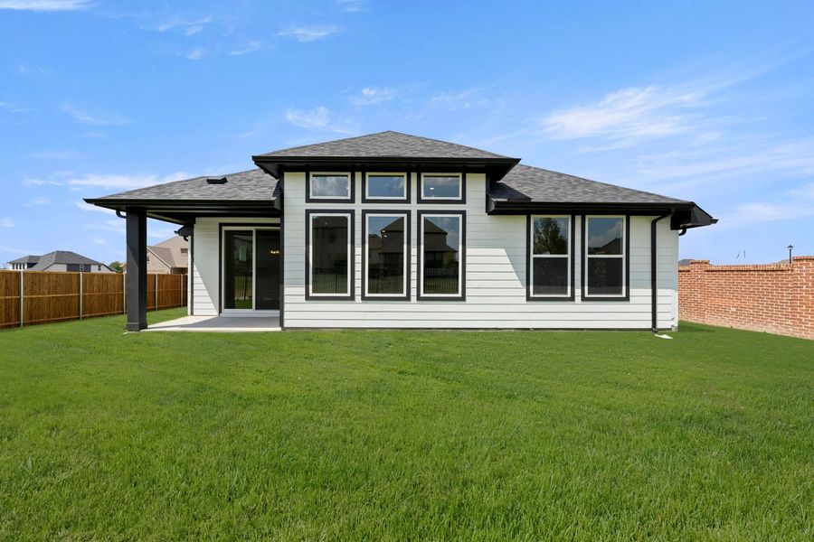 Exterior details and patio area of a home in Creekside, Royse City (Image 21).