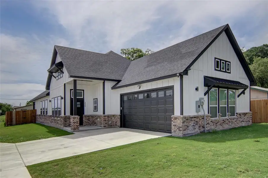 Front exterior of a new home in , Fort Worth, TX, highlighting curb appeal (Image 26). Front exterior of a new home in , Fort Worth, TX, highlighting curb appeal (Image 26).