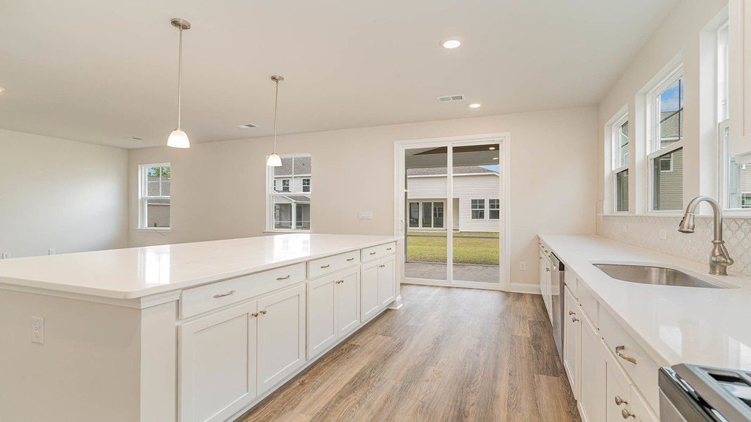 Representative furnished interior of a home built from the FORRESTER by D.R. Horton in Shell Pointe, Gilbert (Image 6).