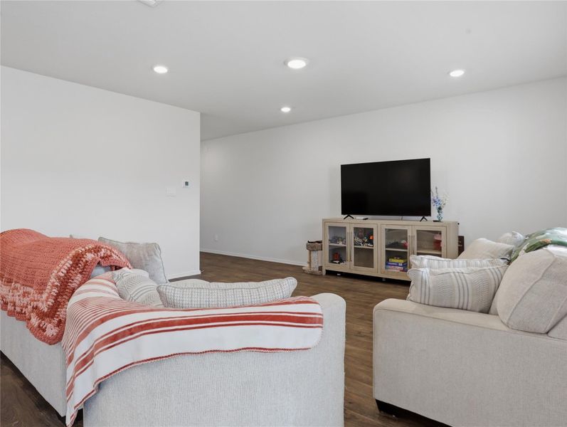 Gleaming hardwood floors and recessed lighting define this versatile living space. Gleaming hardwood floors and recessed lighting define this versatile living space.