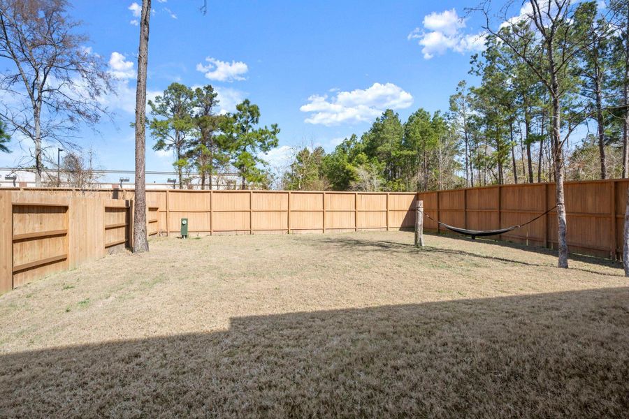 8-foot privacy fencing lines the rear and one side of the backyard. 8-foot privacy fencing lines the rear and one side of the backyard.