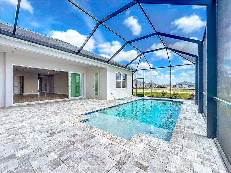 Front exterior of a new home in Watercolor Place Single Family Homes, Bradenton, FL, highlighting curb appeal (Image 26).