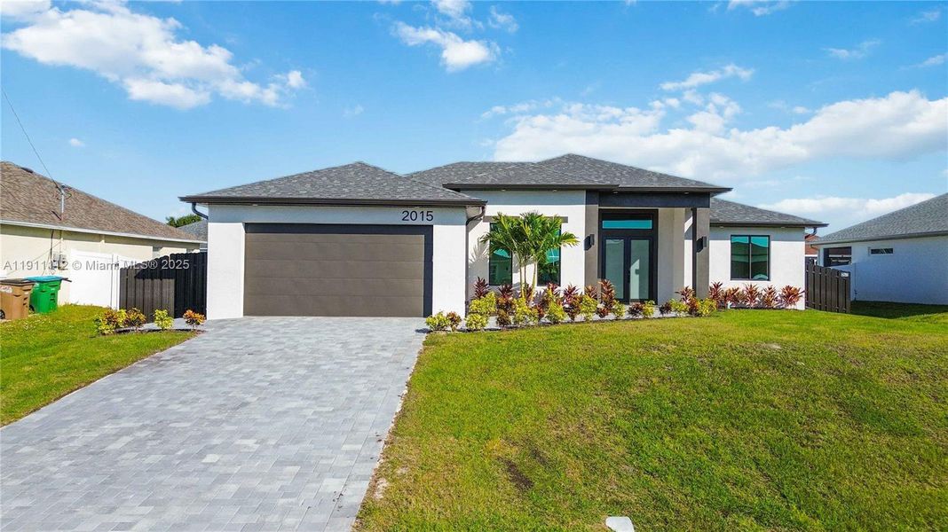 Front exterior of a new home in , Cape Coral, FL, highlighting curb appeal (Image 19). Front exterior of a new home in , Cape Coral, FL, highlighting curb appeal (Image 19).