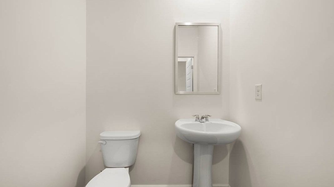 Representative furnished interior of a home built from the Dennis by D.R. Horton in Glenmaye, Hampton (Image 14).