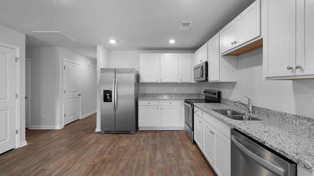 Representative furnished interior of a home built from the SULLIVAN by D.R. Horton in Evergreen, Holly Hill (Image 7).