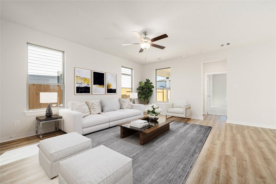 This modern open-concept layout features a seamless connection between the kitchen, dining, and living spaces. Light-toned flooring, recessed lighting, and neutral finishes create a bright, welcoming atmosphere that feels both spacious and refined. This modern open-concept layout features a seamless connection between the kitchen, dining, and living spaces. Light-toned flooring, recessed lighting, and neutral finishes create a bright, welcoming atmosphere that feels both spacious and refined.