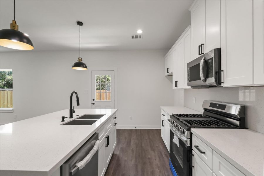 Beautiful Kitchen with appliances and Quartz Countertops Beautiful Kitchen with appliances and Quartz Countertops
