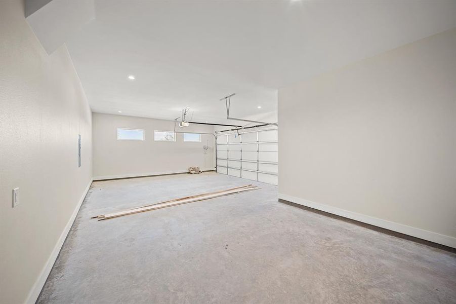 Garage featuring baseboards