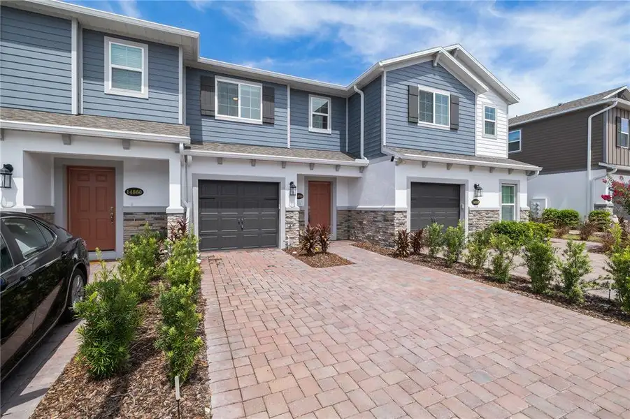 Front exterior of a new home in , Orlando, FL, highlighting curb appeal (Image 16). Front exterior of a new home in , Orlando, FL, highlighting curb appeal (Image 16).