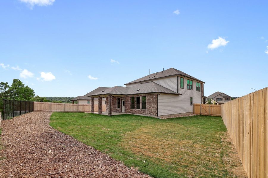 Exterior details and patio area of a home in River Bluff, Leander (Image 3).