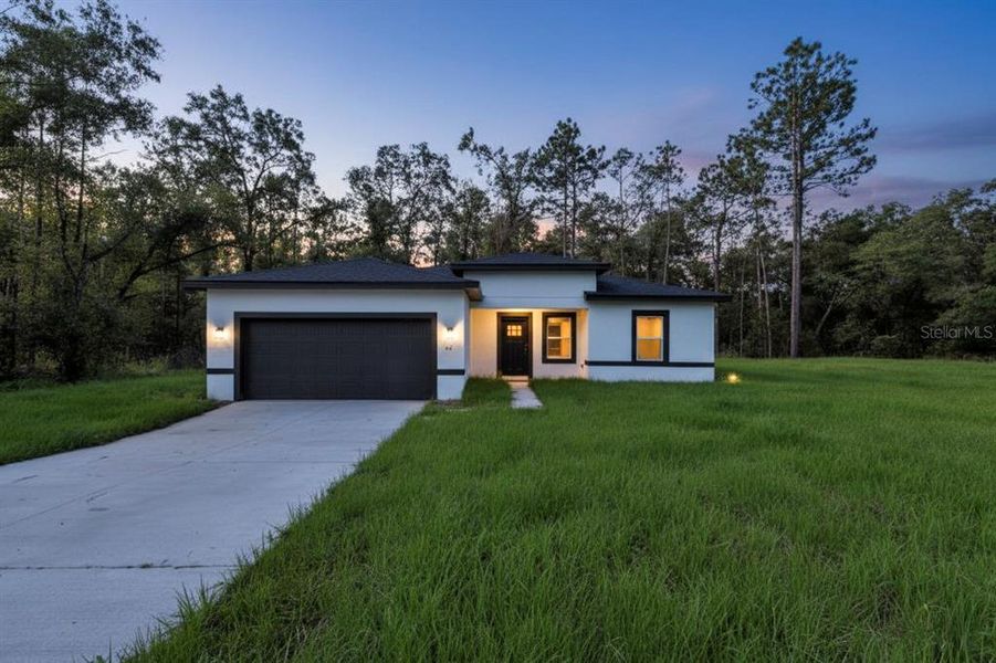 Front exterior of a new home in , Dunnellon, FL, highlighting curb appeal (Image 26).