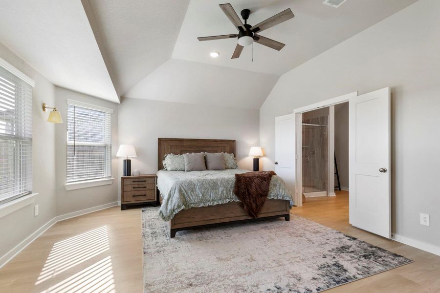 Primary bedroom has an extended bay window.