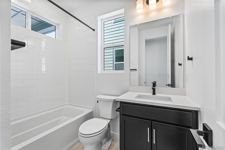 Furnished interior view inside a new home in Tribute at Lyric, Lone Tree (Image 9).