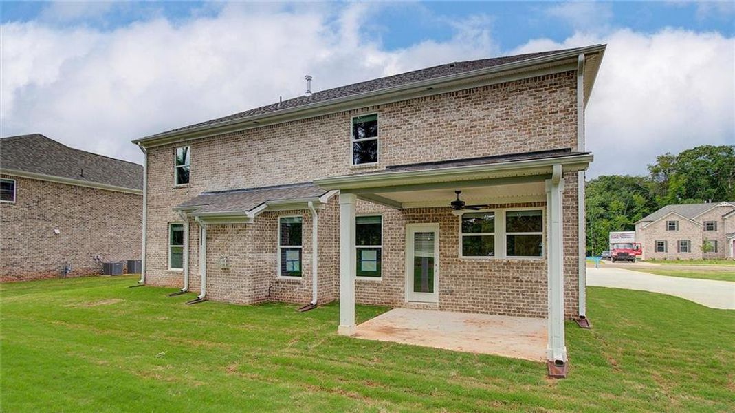 Front exterior of a new home in Trinity Park, McDonough, GA, highlighting curb appeal (Image 19).