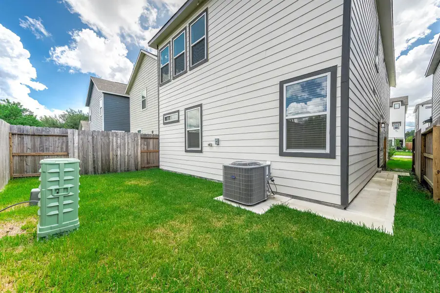 Spacious fully fenced backyard. Spacious fully fenced backyard.