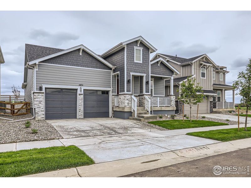 Front exterior of a new home in Barefoot Lakes, Longmont, CO, highlighting curb appeal (Image 2).