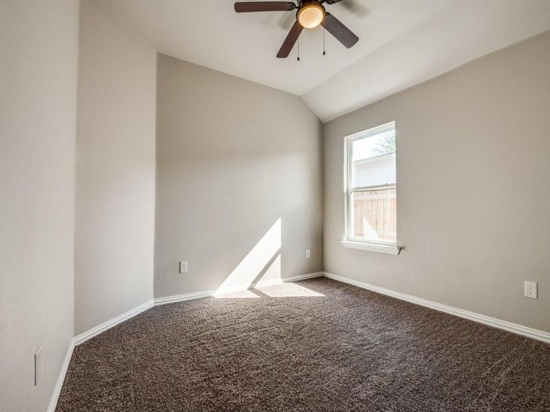 Spare room featuring carpet floors, ceiling fan, and baseboards Spare room featuring carpet floors, ceiling fan, and baseboards