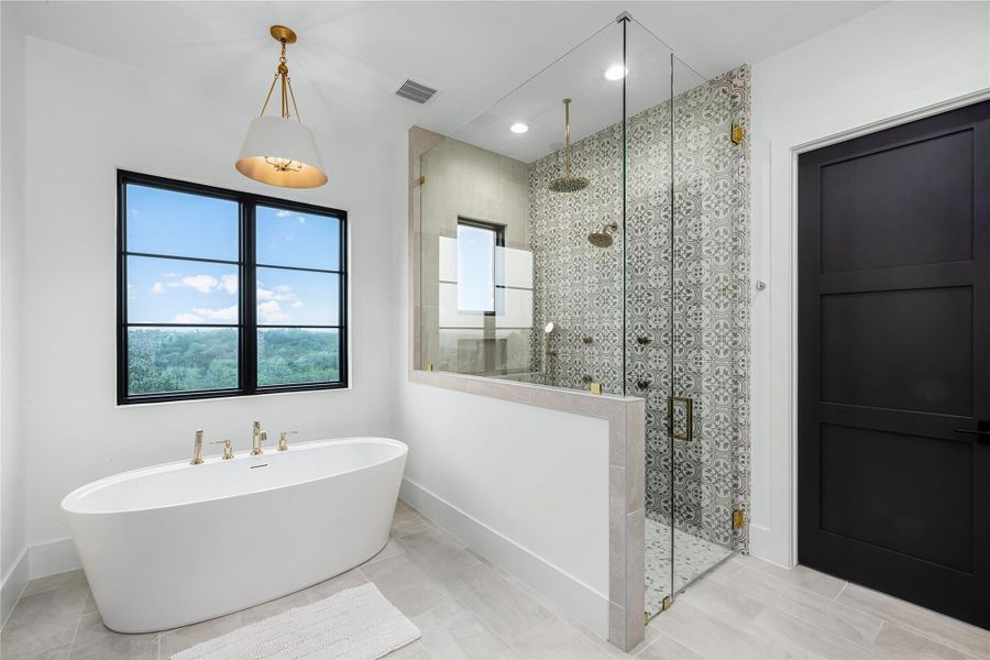 Bathroom with tile patterned flooring and plus walk in shower