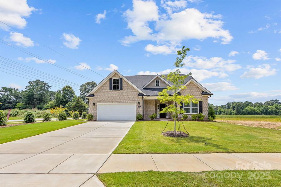 Front exterior of a new home in , Waxhaw, NC, highlighting curb appeal (Image 1). Front exterior of a new home in , Waxhaw, NC, highlighting curb appeal (Image 1).