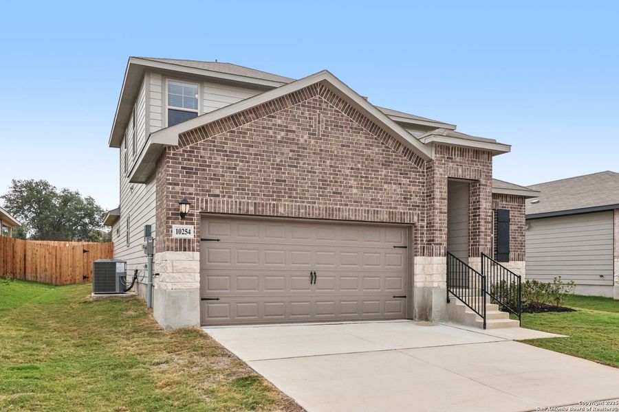 Front exterior of a new home in Royal Crest, San Antonio, TX, highlighting curb appeal (Image 23). Front exterior of a new home in Royal Crest, San Antonio, TX, highlighting curb appeal (Image 23).