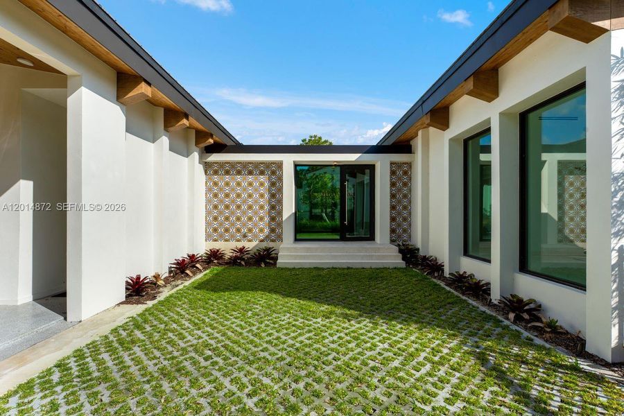 Exterior details and patio area of a home in , Coral Gables (Image 13). Exterior details and patio area of a home in , Coral Gables (Image 13).
