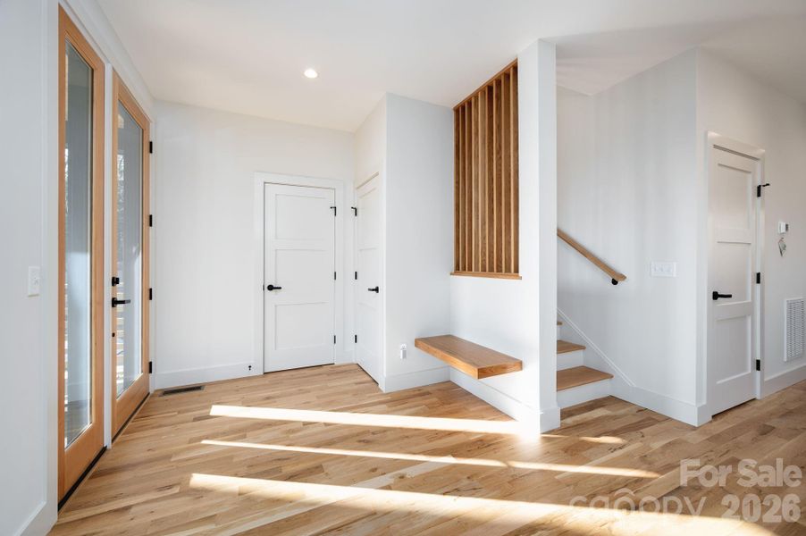 Inviting Entry with Sitting Bench and Coat Closet