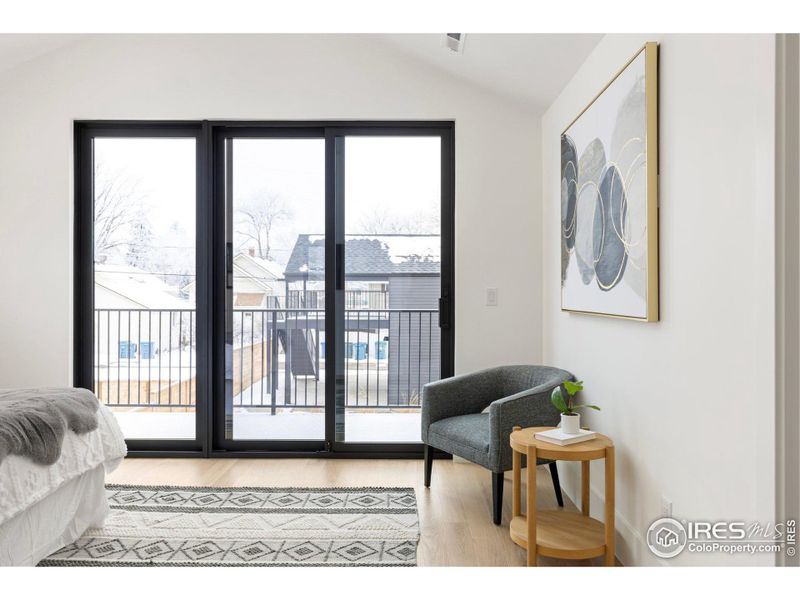 Sliding glass doors to deck off primary bedroom.