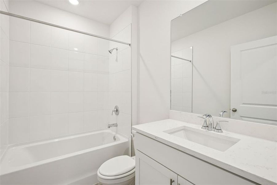 Furnished interior view inside a new home in The Grove at Stuart Crossing - Classic Series, Bartow (Image 9).