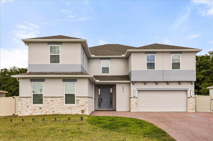 Front exterior of a new home in Bargrove Estates, Mount Dora, FL, highlighting curb appeal (Image 25). Front exterior of a new home in Bargrove Estates, Mount Dora, FL, highlighting curb appeal (Image 25).