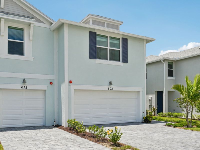 Front exterior of a new home in Tidewater, Fort Pierce, FL, highlighting curb appeal (Image 17). Front exterior of a new home in Tidewater, Fort Pierce, FL, highlighting curb appeal (Image 17).