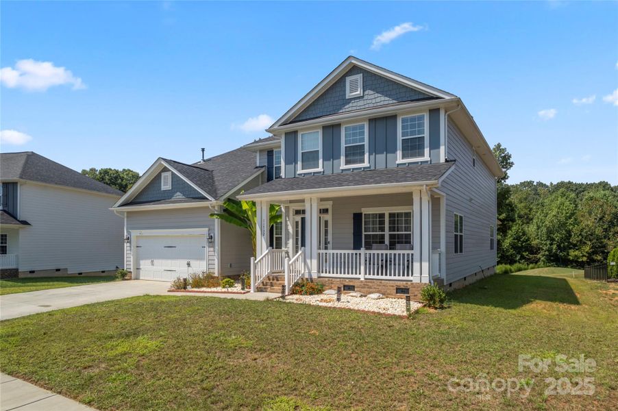 Front exterior of a new home in , Locust, NC, highlighting curb appeal (Image 18).