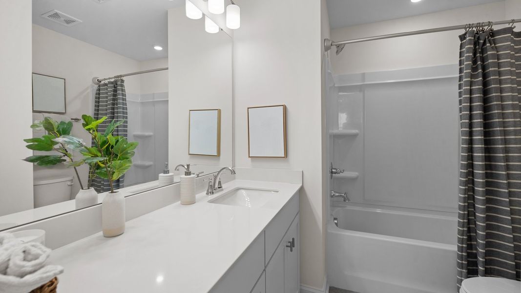 Bathroom with soak in tub and premium finishes in the Rochester Design by DRB Homes Charlotte, NC Bathroom with soak in tub and premium finishes in the Rochester Design by DRB Homes Charlotte, NC