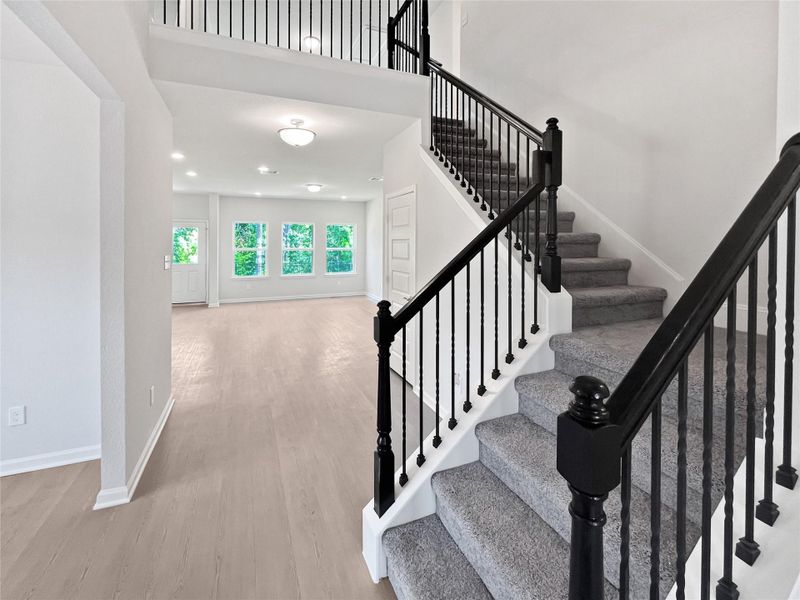 The Princeton II- Staircase with Wrought Iron Railing. Home under construction, image used for illustrative purposes only, colors and options will vary. The Princeton II- Staircase with Wrought Iron Railing. Home under construction, image used for illustrative purposes only, colors and options will vary.