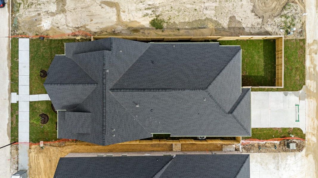 Front exterior of a new home in Riceland, Mont Belvieu, TX, highlighting curb appeal (Image 12).