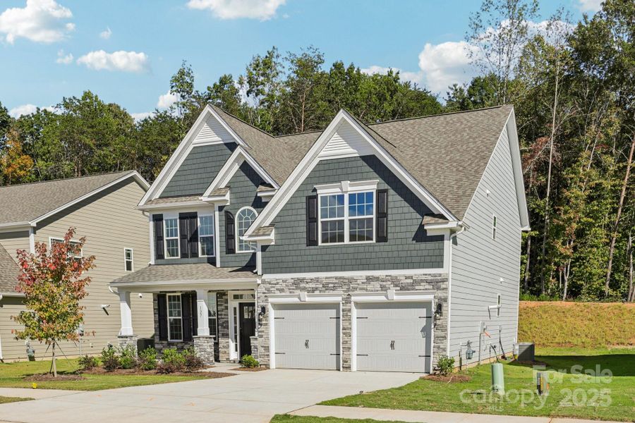 Front exterior of a new home in Falls Cove, Troutman, NC, highlighting curb appeal (Image 24). Front exterior of a new home in Falls Cove, Troutman, NC, highlighting curb appeal (Image 24).