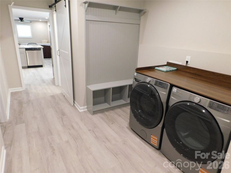 Mud room includes drop zone and washer and dryer