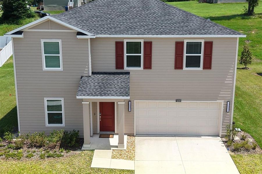 Front exterior of a new home in Tara Forest East, Alachua, FL, highlighting curb appeal (Image 31).