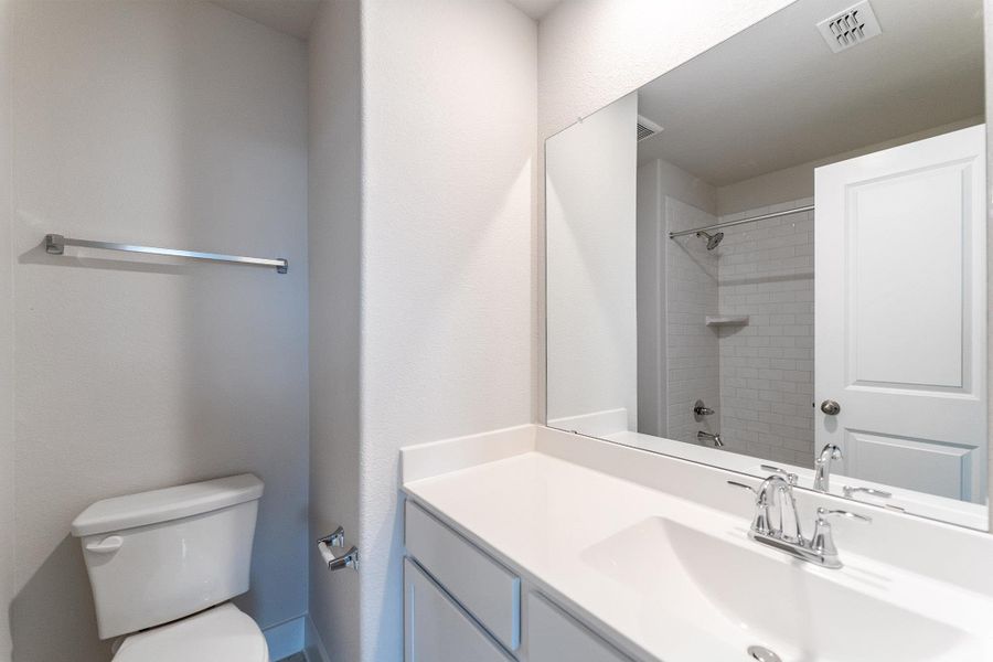 Bathroom with toilet and vanity