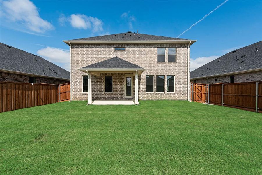 Exterior details and patio area of a home in Spiritas Ranch, Little Elm (Image 4).
