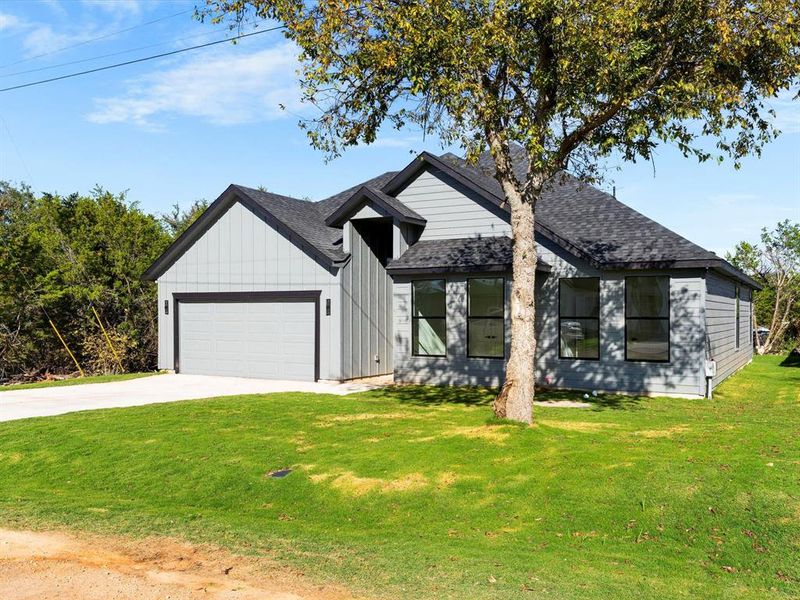 Front exterior of a new home in , Granbury, TX, highlighting curb appeal (Image 22).