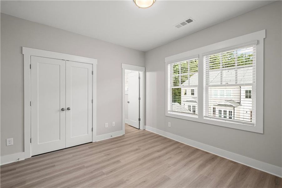 Spacious, unfurnished interior of a new home in Devin's Shire - A Kennesaw Tradition, Kennesaw (Image 29).