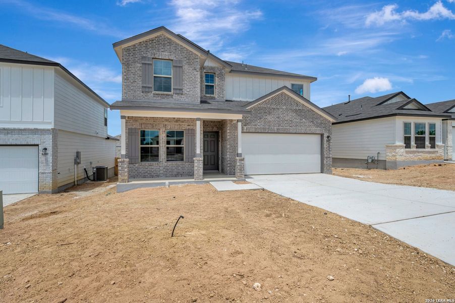 Front exterior of a new home in Mesquite Ridge, San Antonio, TX, highlighting curb appeal (Image 1). Front exterior of a new home in Mesquite Ridge, San Antonio, TX, highlighting curb appeal (Image 1).