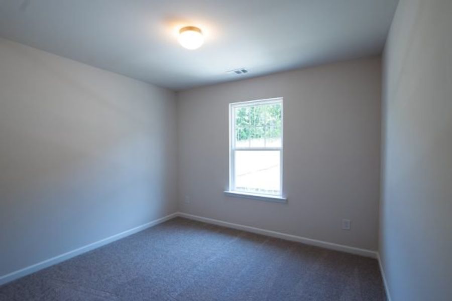 Representative unfurnished interior of a home built from the Fairfax by Piedmont Residential in Falls Creek, Flowery Branch (Image 20).