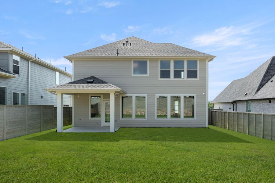 Front exterior of a new home in Treeline, Justin, TX, highlighting curb appeal (Image 16).