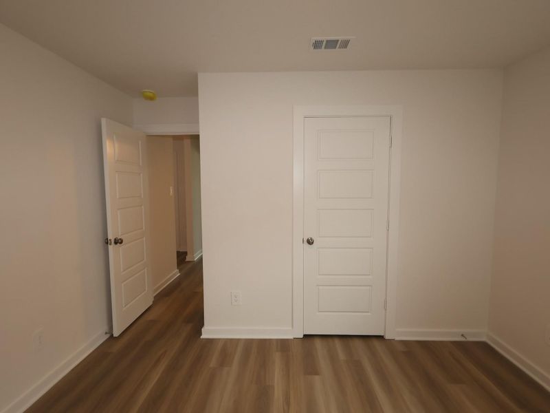 Spacious, unfurnished interior of a new home in Pinewood at Grand Texas, New Caney (Image 21).