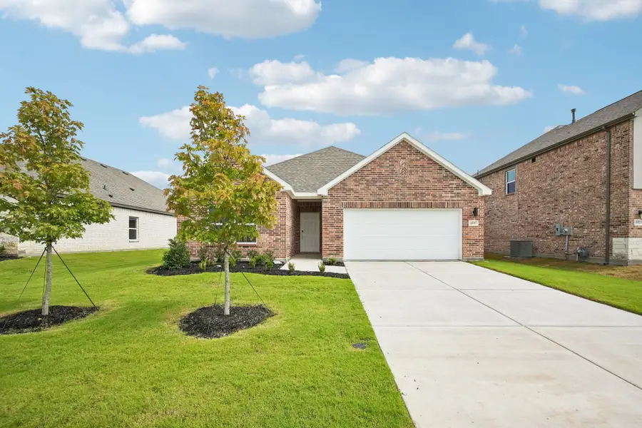Front exterior of a new home in Anna Town Square, Anna, TX, highlighting curb appeal (Image 1). Front exterior of a new home in Anna Town Square, Anna, TX, highlighting curb appeal (Image 1).