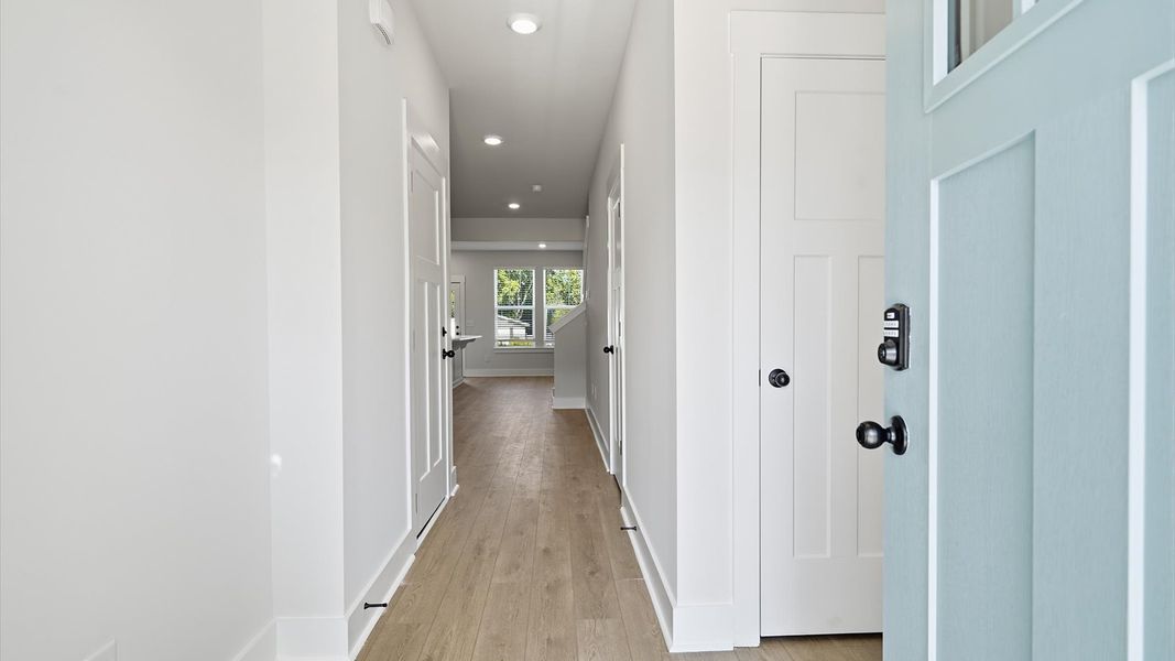 Superior design begins at the front door with a hardwood floor foyer and elegant sightlines Superior design begins at the front door with a hardwood floor foyer and elegant sightlines